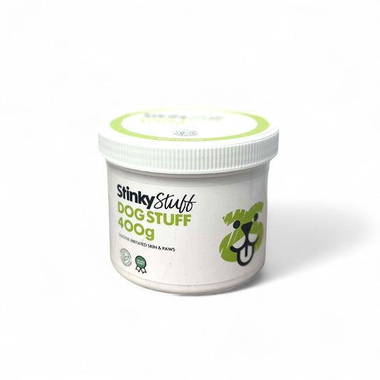 Container of 'Stinky Stuff' dog product on a white background